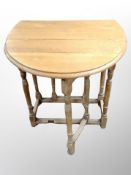 An oak drop leaf gateleg table,