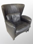 A late 20th century Danish black leather wingback armchair
