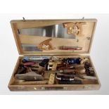 A joiner's toolbox and contents, hand saws, folding rules, wood working planes,