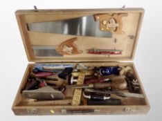 A joiner's toolbox and contents, hand saws, folding rules, wood working planes,
