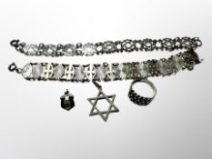 A group of silver jewellery including two panel bracelets, a ring,