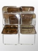 A set of five chrome and perspex folding chairs