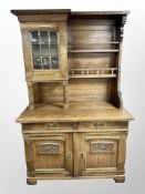 An early 20th century oak dresser fitted with plate rack,