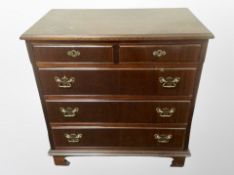 A reproduction mahogany five drawer chest,