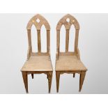 A pair of pitch pine ecclesiastical chairs