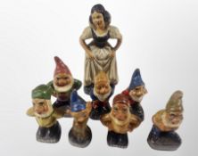 A group of mid century ceramic Snow white and the Seven Dwarfs figures, (Snow White) height 16 cm.