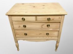 An early 20th century Scandinavian pine four drawer chest,