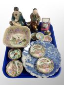 A group of Oriental wares, two porcelain figures, Cantonese famille rose pin dishes,