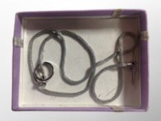 A silver necklace with hoop and T-bar catch,
