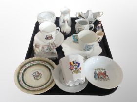 A group of crested porcelain including tea cups, saucers, jugs,