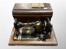 A Jones sewing machine numbered 49649 in case