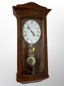 A London Clock Company wall clock in mahogany case