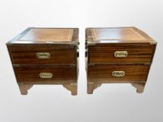 A pair of mahogany brass mounted campaign style bedside tables with brass drop handles,
