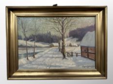 Ragnar Jacobsen (Danish) : A snow-covered village, oil on canvas,