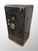 A floor-standing steel safe with key,