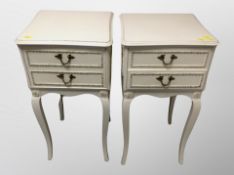 A pair of cream and gilt French style two drawer bedside chests,