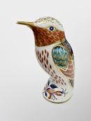 A Royal Crown Derby Hummingbird paperweight with gold stopper