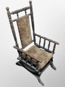 A 19th century ebonised child's rocking chair,