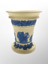 A Wedgwood cane ware vase, decorated in relief, depicting classical figures, impressed mark beneath,