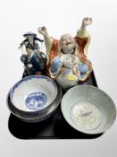 A large Chinese pottery Buddha, three blue and white bowls, two figures,