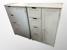 A pair or contemporary storage cabinets fitted with cupboards and drawers