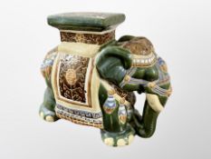 A glazed ceramic elephant plant stand,