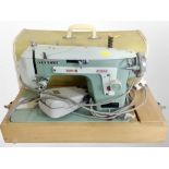 A New Home electric sewing machine,