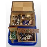 A teak jewellery box and two others containing costume jewellery, beaded necklaces,