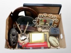 A box of African brass inlaid mask, pair of Roe deer antlers on shield, Brownie junior box camera,
