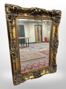 A Victorian style gilt gesso bevelled mirror 123 cm x 90 cm
