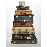 Eight leather and canvas suitcases