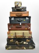 Eight leather and canvas suitcases