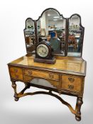 A Queen Anne style burr walnut mirror backed dressing table with later plate glass top,