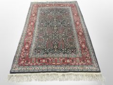 A Hereke rug 239 cm x 154 cm