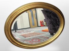 An oval gilt mirror 80 cm x 62 cm