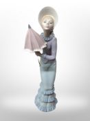 A Lladro figure - Lady holding a parasol,