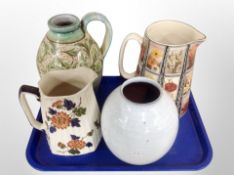 Three English pottery jugs and a further vase