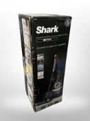 A Shark vacuum cleaner in box