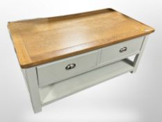 A contemporary oak topped low table fitted drawers,