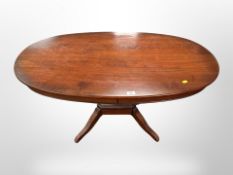 A reproduction oval coffee table,