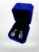 A pair of silver earrings set with Chalcedony blue stones