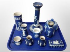 A collection of Wedgwood blue and white Jasperware, large candlestick, vases,
