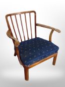 A 20th century beech spindle back armchair