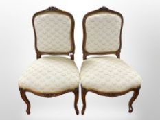 A pair of carved walnut salon chairs