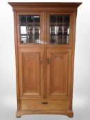 An early 20th century Danish carved oak double door cabinet,