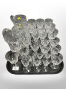 A collection of crystal glasses including wine glasses, ale glasses,