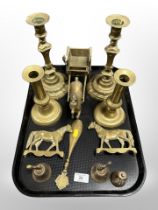 Two pairs of brass candlesticks, brass horse and carriage, two table bells,