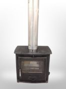 An Aarrow cast iron log burner with flue (refurbished,