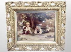 A Victorian crystoleum depicting two children, in ornate gilt frame,