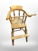 A 19th century elm child's Windsor high chair